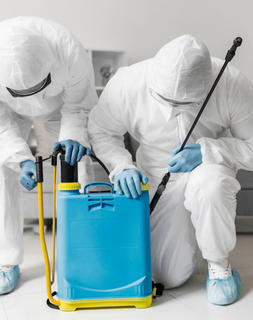 Technicians preparing pest control sprayer equipment – Angel City Pests