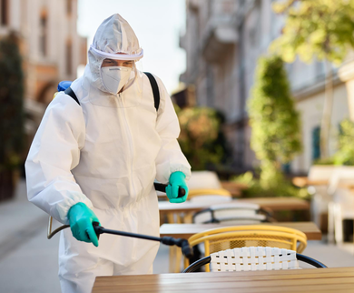 Technician treating outdoor dining furniture for pests – Angel City Pests